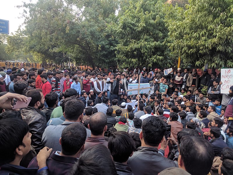 800px-JMI_students_and_locals_protesting_against_CAA_NRC