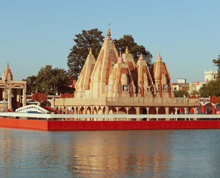 brown concrete building near body of water during daytime